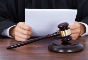 Judge Reading Documents At Desk