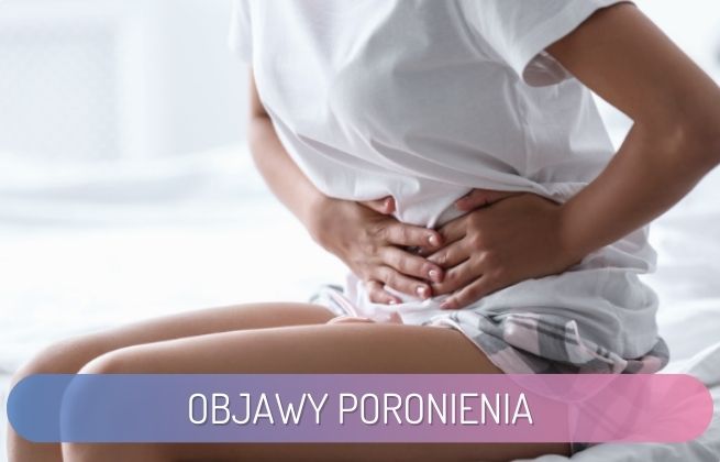objawy poronienia - kobieta trzymająca się z brzuch z powodu skurczy
